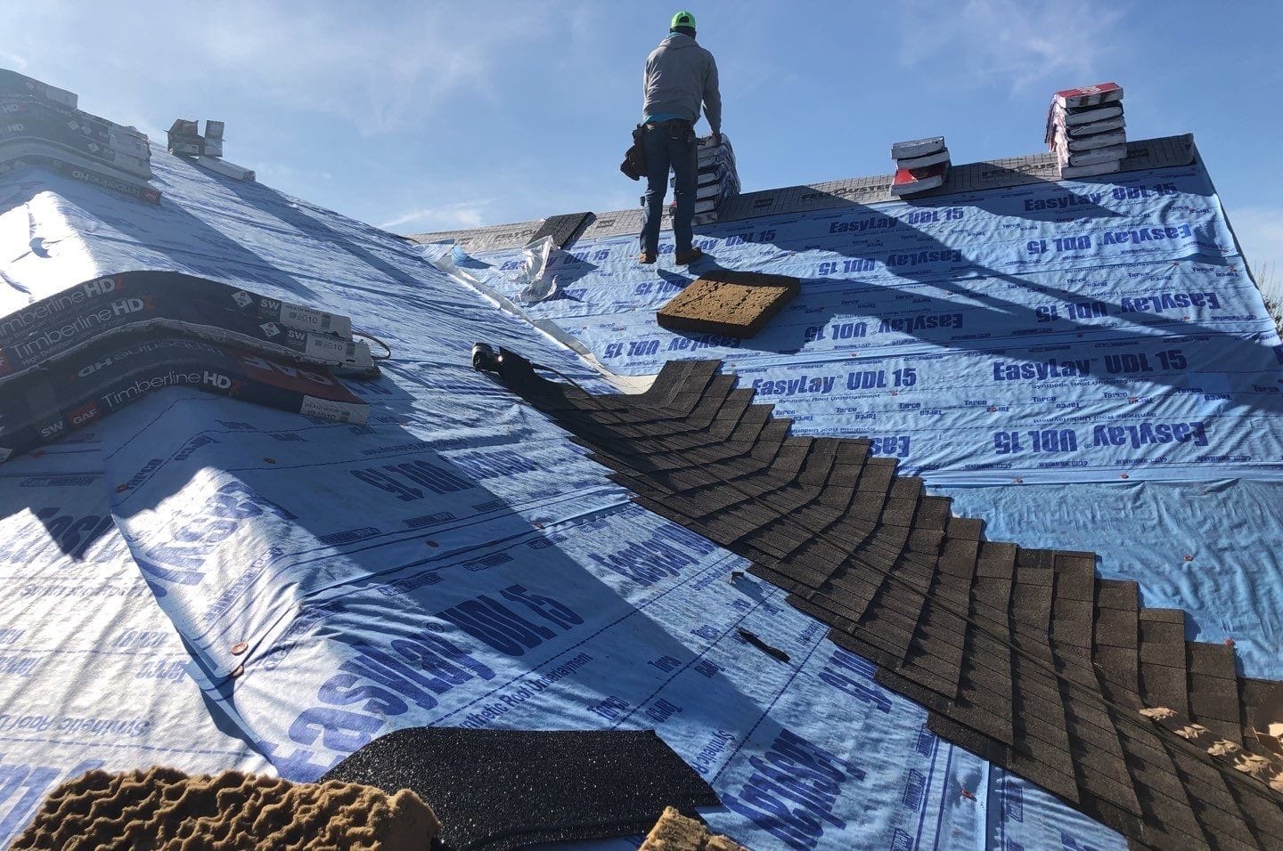 Roof repair by DFW Roofers in Plano, Texas, highlighting the installation of high-quality EasyLay underlayment and starter shingles to prevent leaks